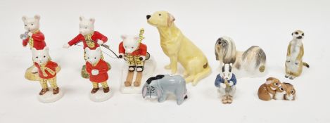 Three Royal Doulton Rupert the Bear figures comprising 'Rupert Takes a Skiing Lesson', 'Rupert's