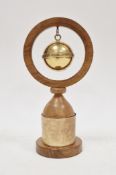 Silver gilt and oak trophy, the oak frame holding a hanging silver gilt orb bell inscribed to the