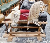 Painted wooden dapple grey platform rocking horse with horse hair mane and tail, leather bridle