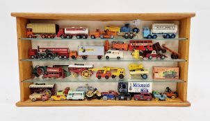 Display cabinet containing a collection of diecast vehicles including boxed Matchbox new 47