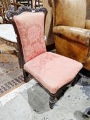 19th century mahogany nursing chair with shaped foliate scrolling back rail and pink damask