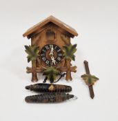 20th century carved cuckoo clock, possibly from the Black Forest, with two weights