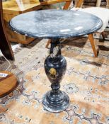 Black marble lamp/wine table, the circular top raised on a vase-shaped column support, with gilt