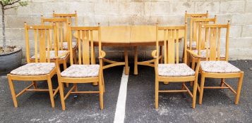 Ercol Golden Dawn dining suite comprising an oval extending dining table, raised on turned