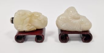 Chinese carved muttonfat jade snuff bottle of triangular form and surmounted by kylin, with jade