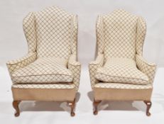 Pair of tall wingback armchairs in the George III manner, contemporary upholstered in a pale
