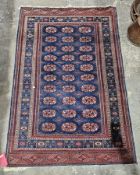 Pakistan lozenge design rug with blue background, 180cm x 125cm