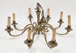 Large gilt brass electrolier with eight foliate scroll branches with faux candle sconces,