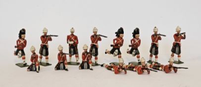 Britains repainted lead Scottish regiment soldiers, one with articulated arms, marked to
