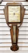Early 20th century oak Art Deco wall barometer and thermometer, 71cm high