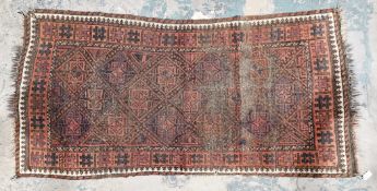 Very old Afghan rug, diamond shape design in blue and red with orange background leading to cream