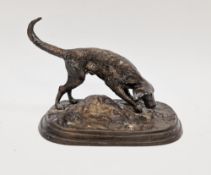 Cast bronze model of a hunting dog, on stepped oval base, 26cm long x 19cm high