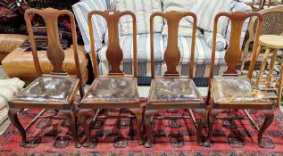 Set of four early 20th century walnut dining chairs in the Queen Anne manner with vase shaped