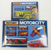 Two boxed Matchbox 'Motorcity' diecast vehicle gift sets including MC-15 (MC15) 6 fire vehicle set