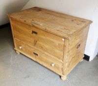 19th century pine mule chest or coffer, the lid opening to a candle box and an open space, over a