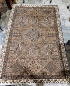 Eastern wool rug of Caucasian design with mushroom brown field, having stepped lozenge to centre,