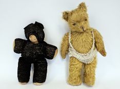 Golden mohair teddy bear, straw filled with hump back, amber and black plastic eyes, stitched nose