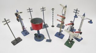 11 various Hornby tinplate accessories to include lamps, signals, water tank and telegraph poles (