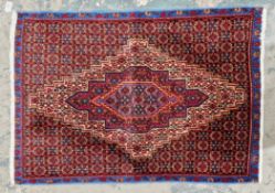 Hand knotted Iranian rug of the finest quality, centre piece with intricate unusual design in blue
