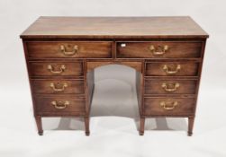 19th century mahogany kneehole desk/dressing table with an arrangement of eight drawers around a