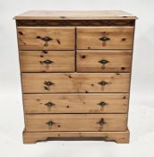 Modern pine chest of four short drawers over three long drawers, with metal handles, 83cm wide x