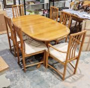 Mid century retro Danish dining room suite comprising an oval teak extending dining room table