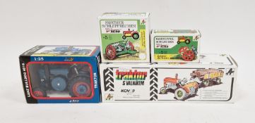 Boxed Zetor clockwork tractor and trailer, boxed Lanz clockwork tractor and two boxed Kovap Agro