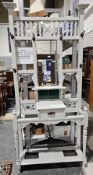 Late 19th/early 20th century oak hallstand, the back with a central bevelled edge mirror, shelf