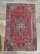 Old Iranian rug, 100% wool, centre piece coral with green, orange, turquoise and green, very unusual