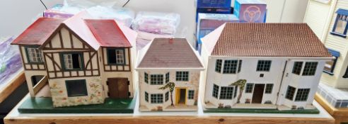 Three mid century Triang doll's houses, two with metal fronts including model no. 55 (67cm wide x