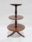 Early 19th century mahogany whatnot, the three graduating circular shelves with satinwood string