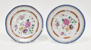Pair of Chinese export famille rose plates, 18th century, each painted with flower-sprays within a