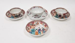 Pair Chinese porcelain tea bowls and three matching saucers, all painted with famille rose colours