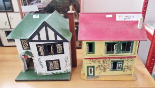 Two mid century wooden doll's houses in the form of 1930's/40's detached houses, both painted, one