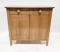 Mid century retro Gordon Russell-style pale oak sideboard with two drawers over two cupboards (