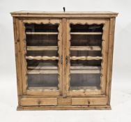 Victorian pine glazed bookcase, the two glass doors with shaped surrounds opening to three fixed