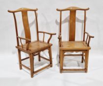 Pair of Chinese pale elm seated Officials Hat elbow chairs with shaped solid plain splats over