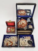 Collection of costume jewellery in a lacquered musical table-top jewellery box, including a group of