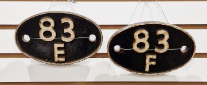 Two mid century railway cast iron oval shedplates (shed plates), 83E and 83F, each 19cm long