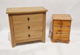 Modern oak chest of three long drawers, 77cm high x 80cm wide x 43cm deep and a pine bedside chest