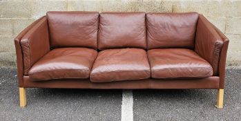 Danish brown leather three-seater sofa by Stouby, raised on square pale beech legs, 204cm long x