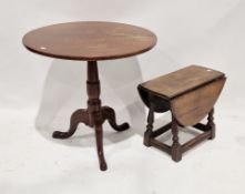 George III mahogany supper table, the circular tilt-top raised on a turned column support with three