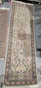 Pakistani Kashan beige double knotted wool ground runner, with central floral medallion on floral