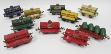 Nine Hornby tinplate '0' gauge tankers to include 'Motor Shell Spirit', 'Pratts', 'Shell Lubricating