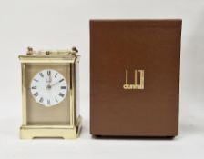 Dunhill brass repeater carriage clock having engine-turned face surrounding a white enamel dial,