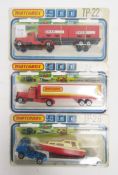 Three carded Matchbox 900 diecast lorry sets including TP-26 articulated truck and low bed trailer