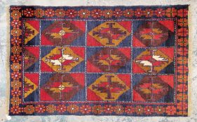 Afghan wool hand knotted rug, nine diamond shaped central sections in brown, blue, red and mustard