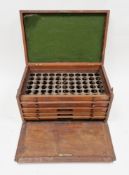Late 19th/early 20th century mahogany coin collectors cabinet with plaque to the front reading '