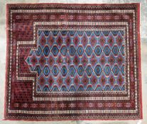 Pakistan rug in red, blue, cream lozenge design, 100cm x 114cm