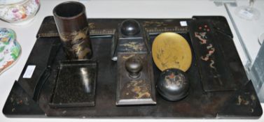 Chinese black and gilt lacquered desk set comprising jotter holder, pen pot, blotter, etc